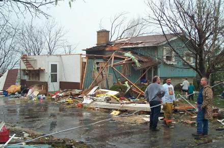 Tornado survivors amid storm damage.