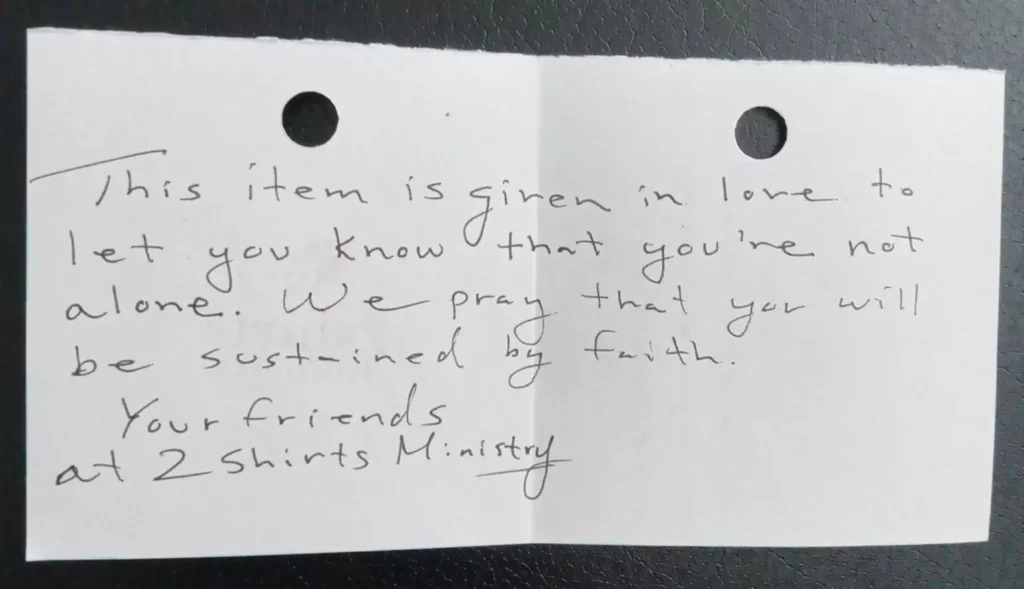 Handwritten care message from 2 Shirts Ministry given to the people we serve...unsheltered homeless, disaster survivors, and children entering emergency foster care.